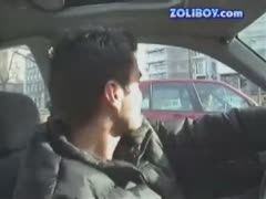 While operating the vehicle, Guy massages the crotch of his redhead bitch.